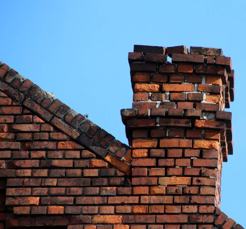 Signs Your Downers Grove Home Needs a Chimney Inspection Damaged chimney on an Downers Grove home showing cracks and missing mortar